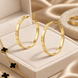 Жіночі сережки-кільця з гравіюванням &mdash; золотисті, у стилі Cartier Love 0160 фото 2